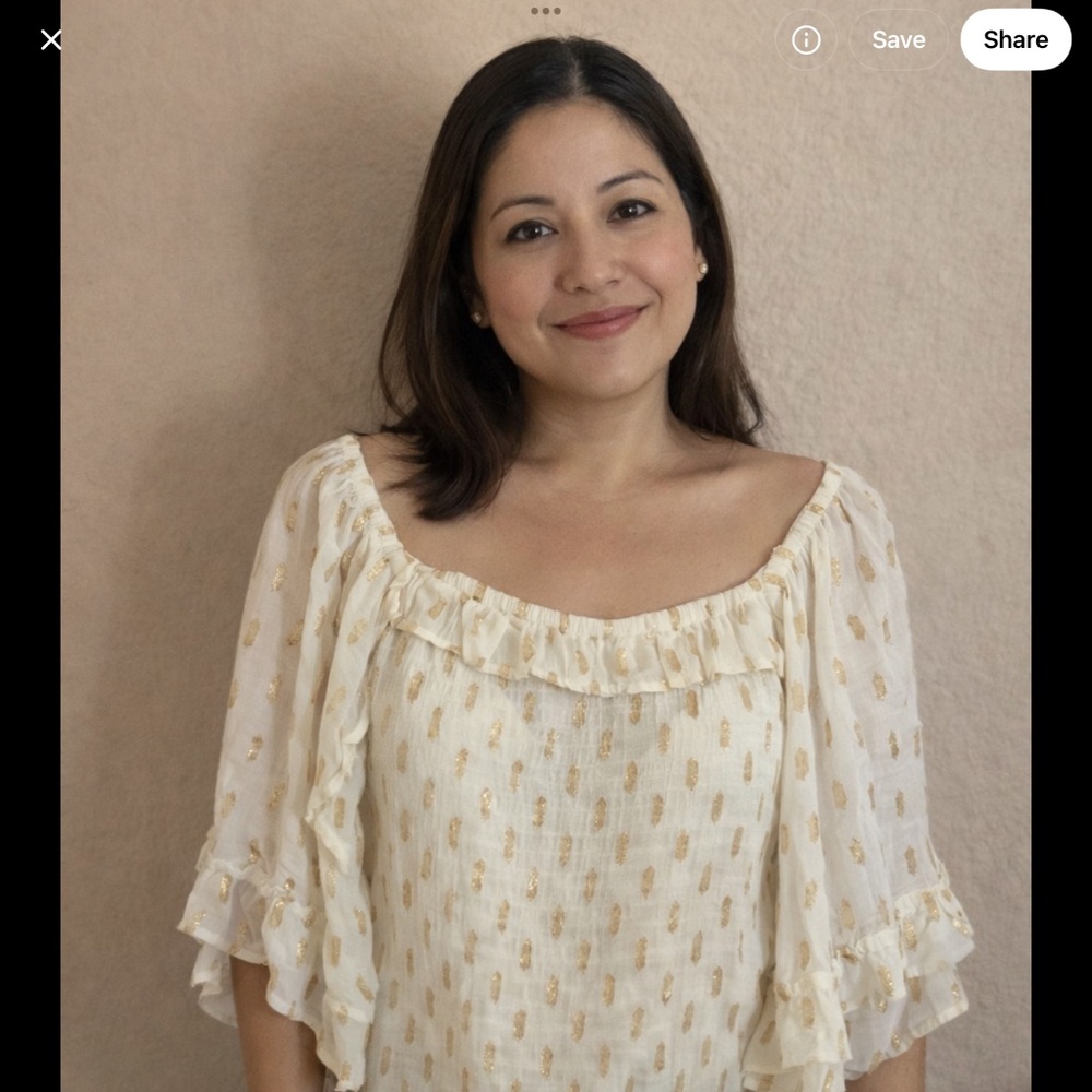 Woman’s medium size ivory flutter sleeve blouse